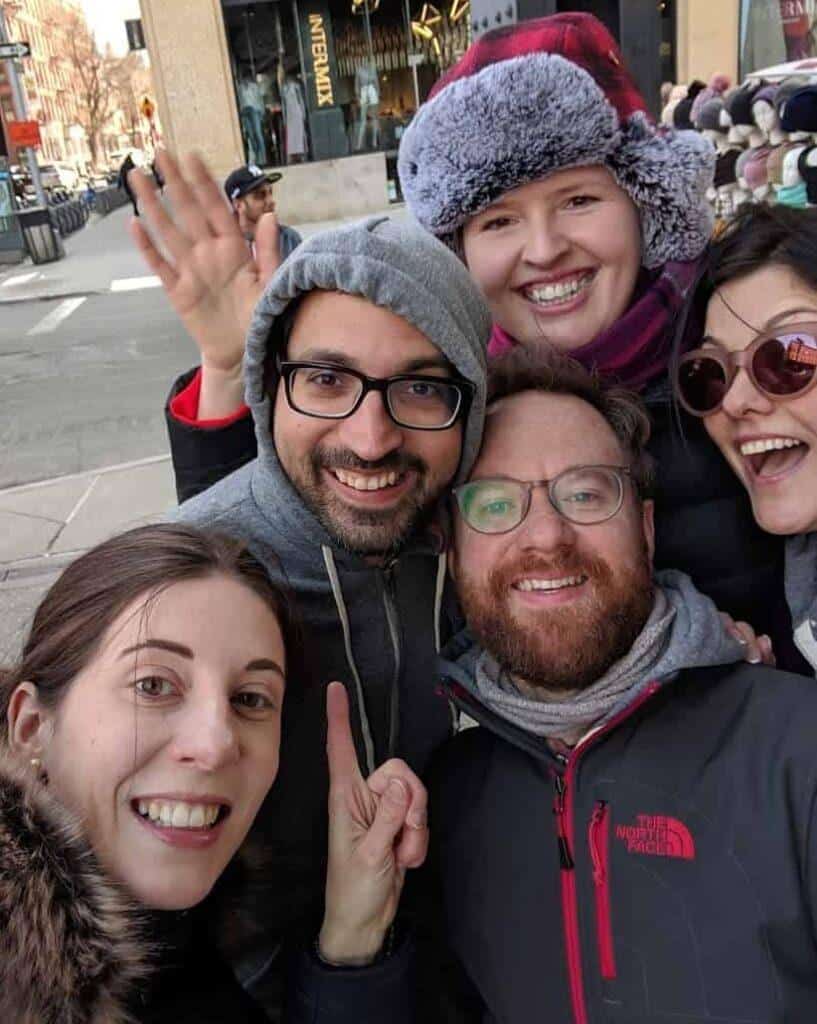 Smiling team taking selfie during Meatpacking District scavenger hunt in NYC